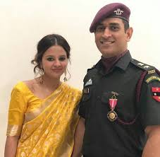 Sakshi Dhoni with her husband