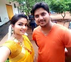 Nithya Ram with her husband