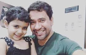 Dinesh Lal Yadav with his daughter