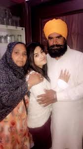Kaur B with her parents