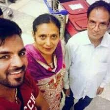 Happy Raikoti with his parents