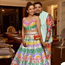 Neha Pendse with her husband