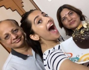 Anagha Bhosale with her parents