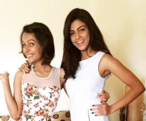 Anisha Ambrose with her sister